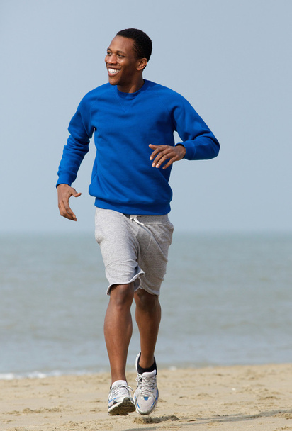 Handsome young man jogging - Photo, Image
