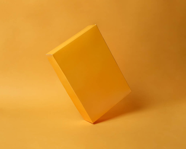 Rectangular object that has the same color as the background. With lighting from only one direction, it makes photos memorable elegant and minimalist. Color game mockup. - Φωτογραφία, εικόνα