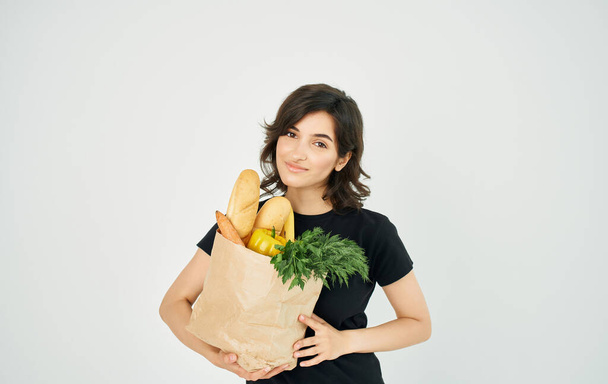 Woman with package of healthy food supermarket shopping - Foto, immagini