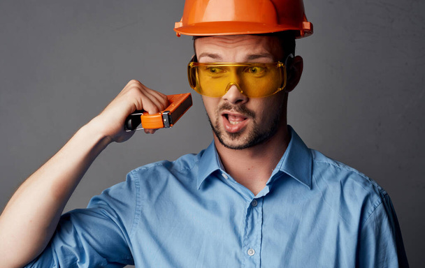 construction engineer in hard hat repair work repair tool - Foto, Bild