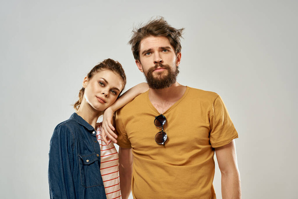 Young couple lifestyle emotions communication fashion light background - Φωτογραφία, εικόνα