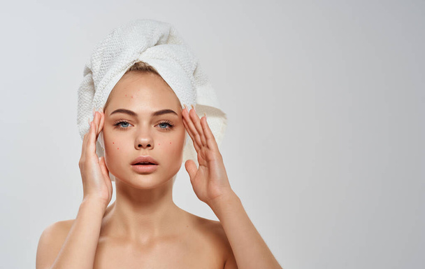 Semi-nude woman straightens a towel on her head clean skin hair model - Photo, Image