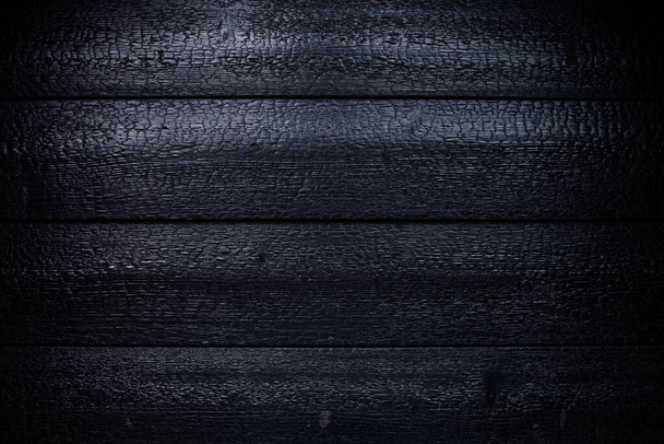 charred log background texture. burnt wood texture, Burned scratched hardwood surface. Smoking wood plank background. Black coal texture after fire - Φωτογραφία, εικόνα