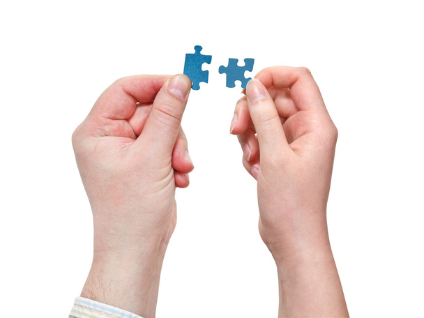 male and female hands with little puzzle pieces - Photo, Image