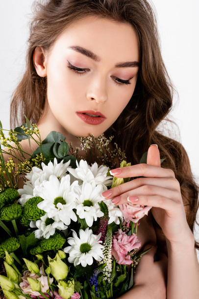 Model with naked shoulders touching chrysanthemum isolated on grey  - Fotoğraf, Görsel