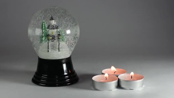 Χιονόμπαλα με κίνηση κεριών - Πλάνα, βίντεο