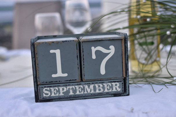 Wood blocks in box with date, day and month 17 September. Wooden blocks calendar - Photo, Image