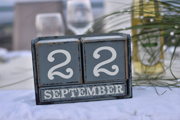 Wood blocks in box with date, day and month 22 September. Wooden blocks calendar - Photo, Image