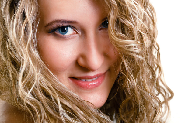 portrait of a beautiful young girl with long blond wavy hair - Fotó, kép