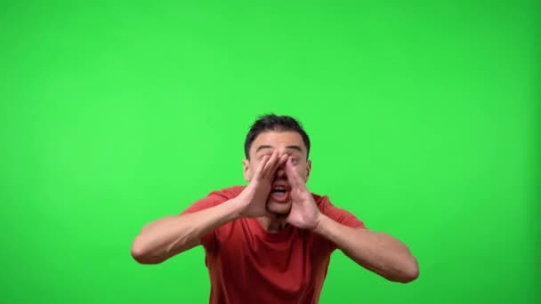 Man screaming for someone. Chroma green background. - Footage, Video