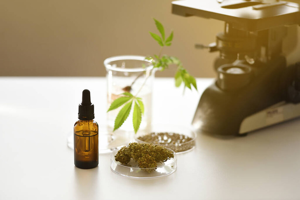 Cbd oil extraction laboratory with vial drop counter, seeds and miscroscope - Photo, Image