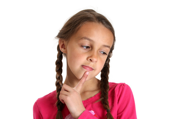 Young girl thinking with her finger on her chin - Foto, afbeelding