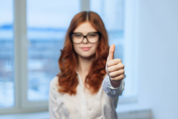 cheerful female manager in the office gesturing with her hands Professional - Photo, Image