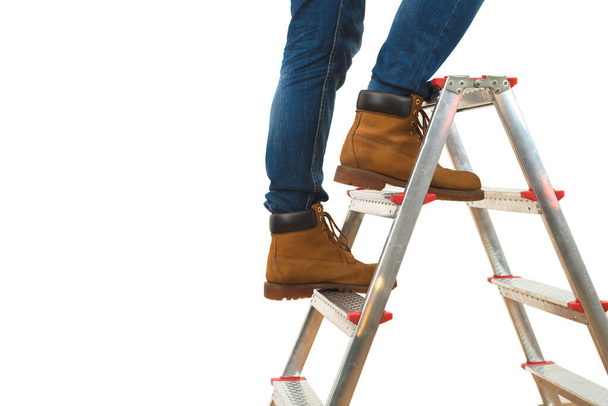 The legs on the ladder on the white background - Photo, Image