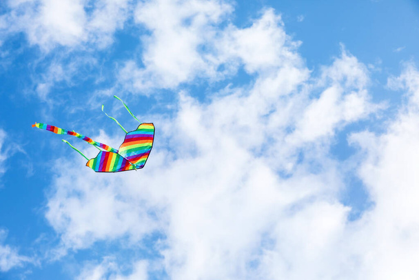 Colorful kite flying in blue sky - Photo, Image