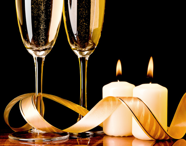 Two glasses with champagne and candles - Photo, Image