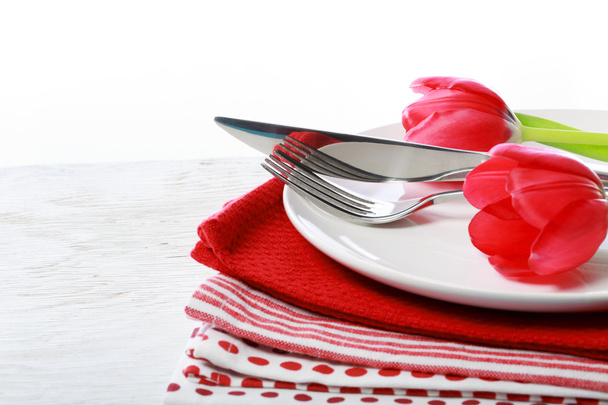 Dishware with red tulips - Fotoğraf, Görsel
