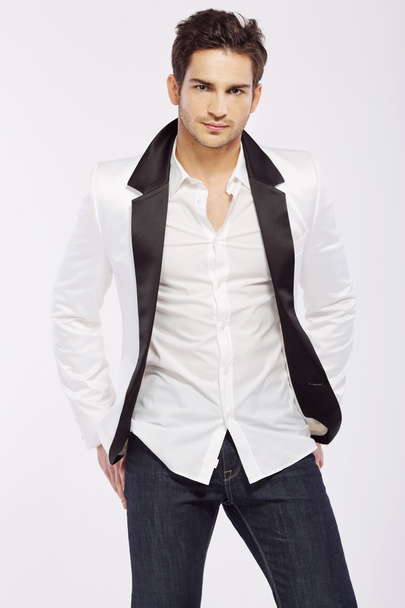 Handsome young guy wearing white jacket - Foto, imagen