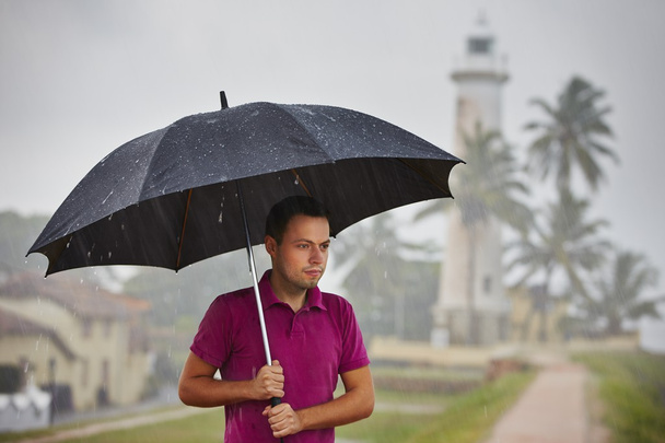 Man in heavy rain - Фото, зображення