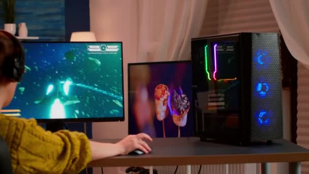 Gamer trying to win space shooter video game playing from home - Footage, Video