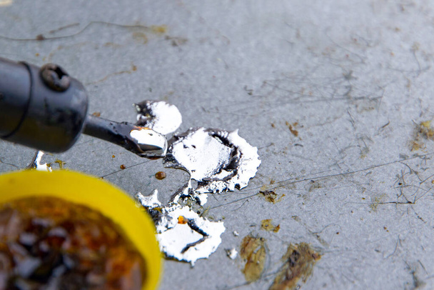 soldering iron with rosin and tin, drops of molten metal, selective focus, close - Photo, Image