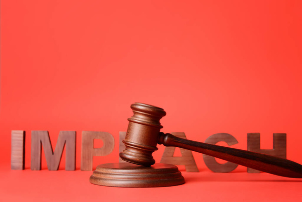 Word IMPEACH and judge gavel on color background - Photo, Image