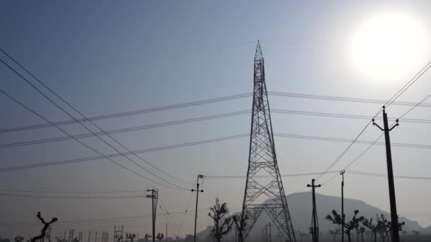 Energy transmission Tower with sunshine rays. Power lines with sunshine sky background. 4k high quality video. - Footage, Video