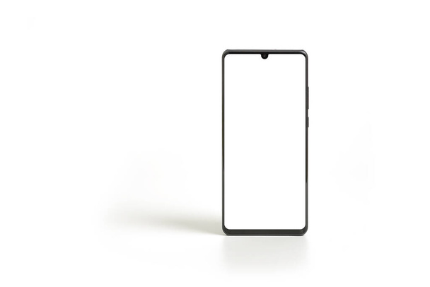 Черный современный макет смартфона. Технология мобильного смартфона фронтальный пустой экран студия снята изолированы на белом фоне с вырезкой пути - Фото, изображение