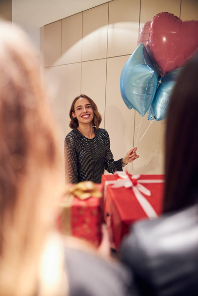 High-spirited birthday girl getting gifts from her friends - Photo, Image
