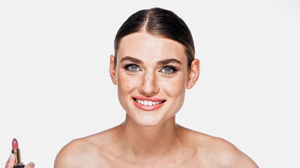 happy woman with makeup on face smiling isolated on white - Fotografie, Obrázek