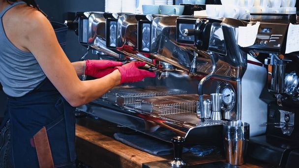 partial view of barista holding portafilter in coffee shop - Photo, Image