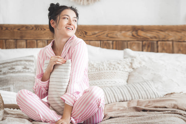 Attractive woman in bedroom. Female in pajamas. - Fotoğraf, Görsel