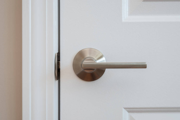 Photograph of a modern styled nickel closet door lever - Photo, Image