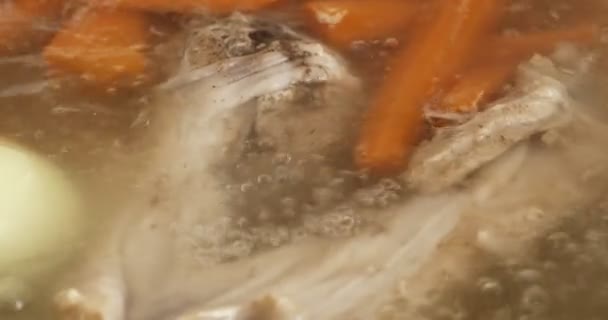 Boiling broth with meat and vegetables close-up. Soup cooking. - Footage, Video