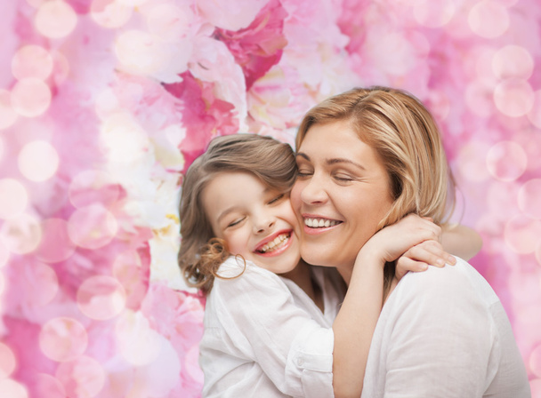 Happy mother and daughter hugging - 写真・画像
