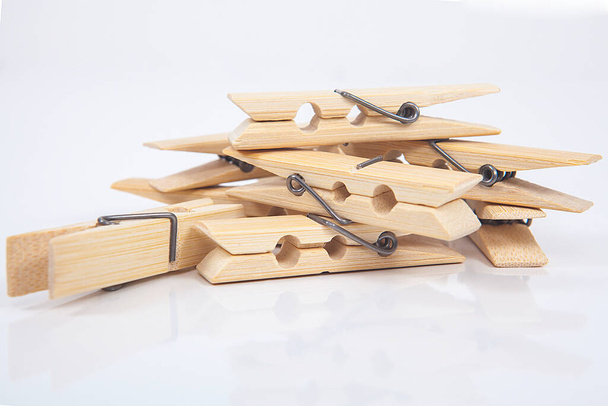 Wooden clothes pegs isolated on a white background. - Photo, Image