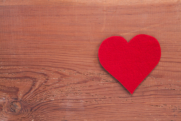 Red heart sign on wooden background. Heart, love and valentines day concept. - Photo, Image