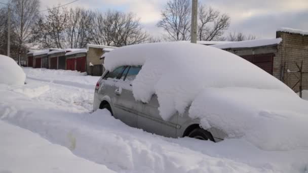 Car under thick blanket of snow after storm. Vehicles buried under ice. Nobody  - Footage, Video