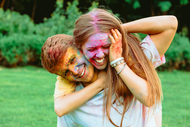 young pretty couple having fun at holi fest. spring fest - Photo, Image