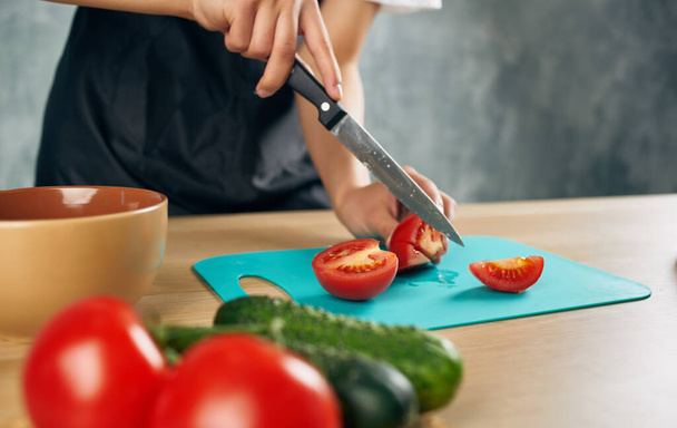 Slicing fresh vegetables cutting table food preparation kitchen healthy food - Photo, Image