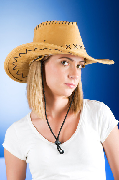 Young girl wearing cowboy hat in the studio - Photo, Image