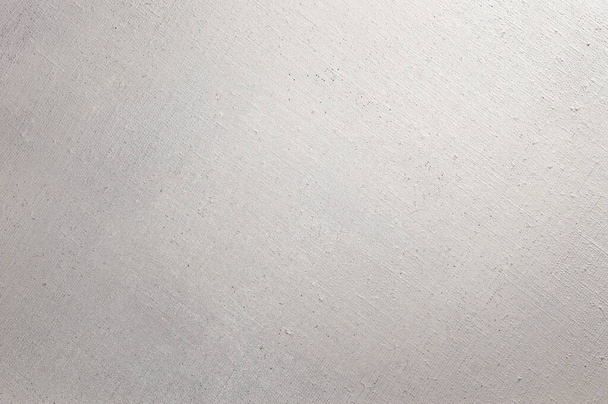 Kreativer Hintergrund: weiß grundiertes Leinen für die Ölmalerei, Flecken weißer Grundierung  - Foto, Bild