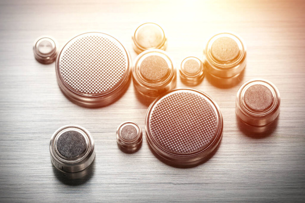 closeup button cell battery or watch battery or coin cell, used to power small electronics devices such as wrist watches or computer motherboard. - Photo, Image