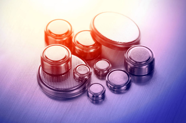 closeup button cell battery or watch battery or coin cell, used to power small electronics devices such as wrist watches or computer motherboard. - Foto, afbeelding