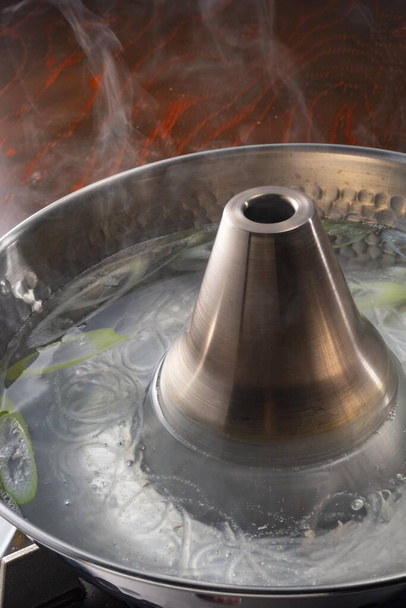 Pot boiling on stove in kitchen - Foto, Imagem