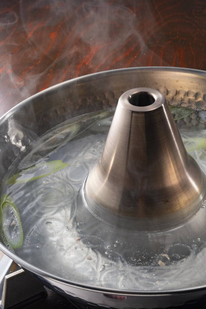 Pot boiling on stove in kitchen - Foto, Imagem