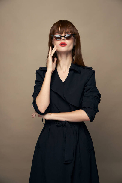 Sexy woman touches her face with her hand and sunglasses short hairstyle  - Photo, Image