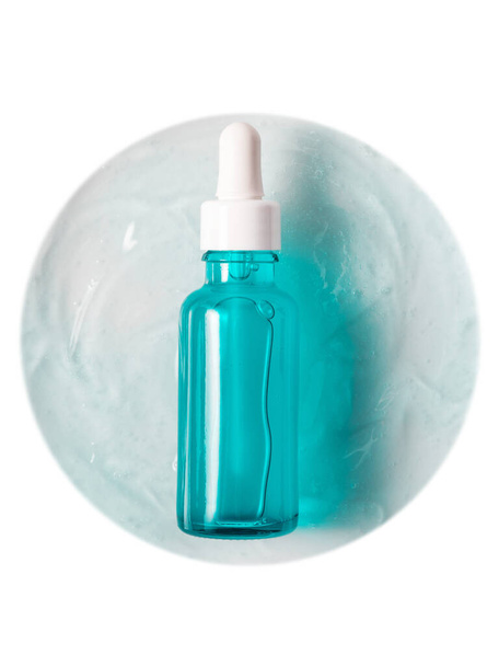 Face serum generic bottle on textured background isolated on white - Photo, Image