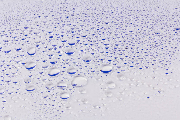 Drops of water on a color background. Selective focus. - Photo, Image