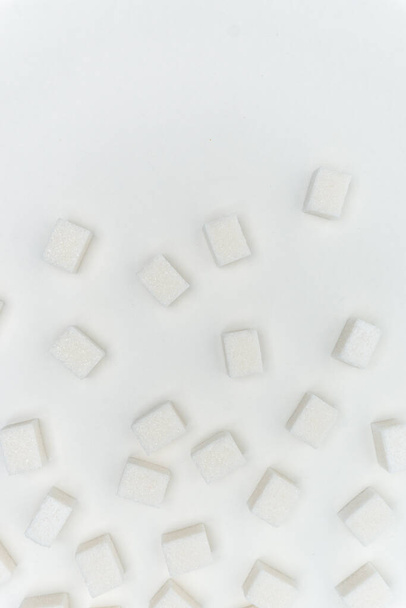 sugar cubes on a light background Glucose ingredient - Fotó, kép